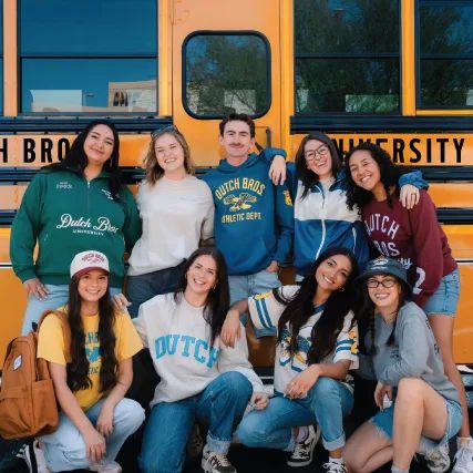group of young people wearing dutch bros new back to cool collection merch