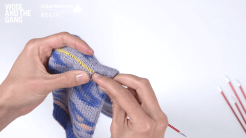 Pick up heel stitches and remove waste yarn: Knitting an afterthought heel - Step 1