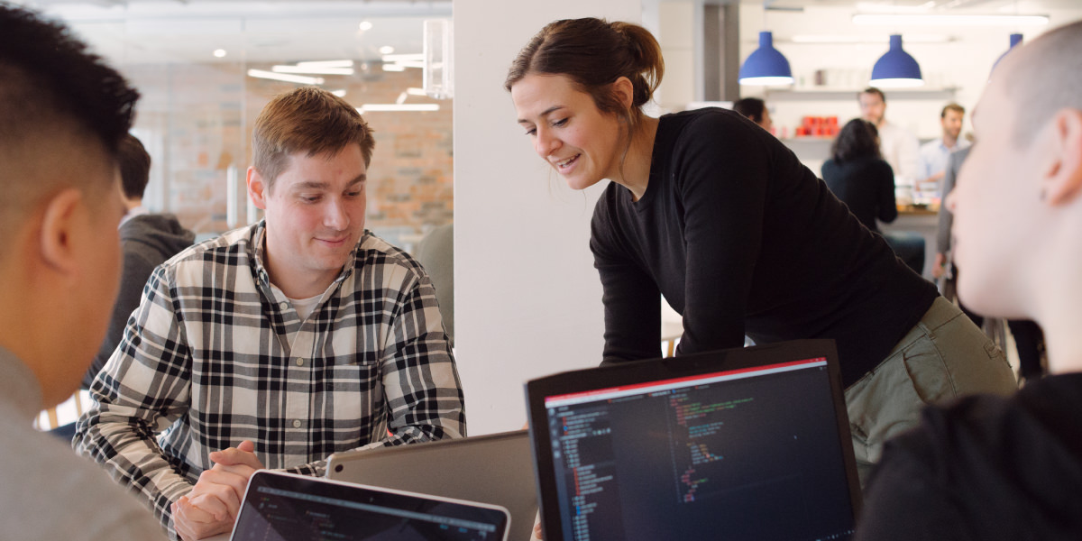 Students getting help from an instructor.