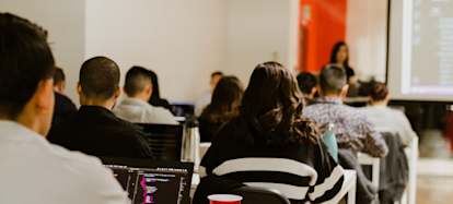 Juno College coding bootcamp students learning web development in a classroom in Toronto