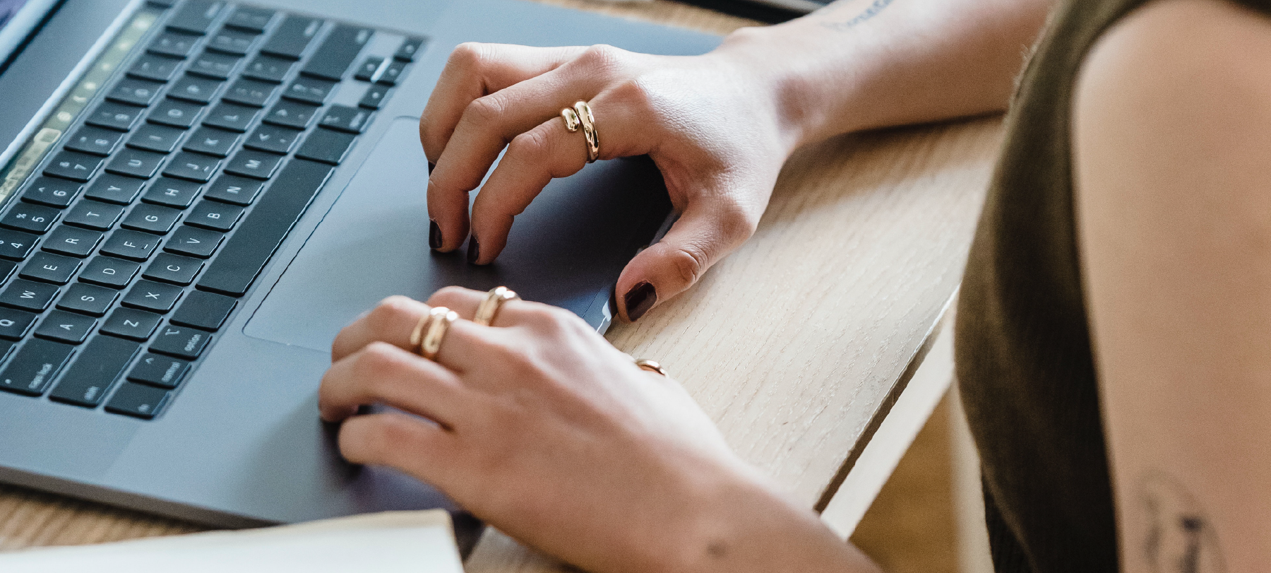 Juno College student typing on computer during online course