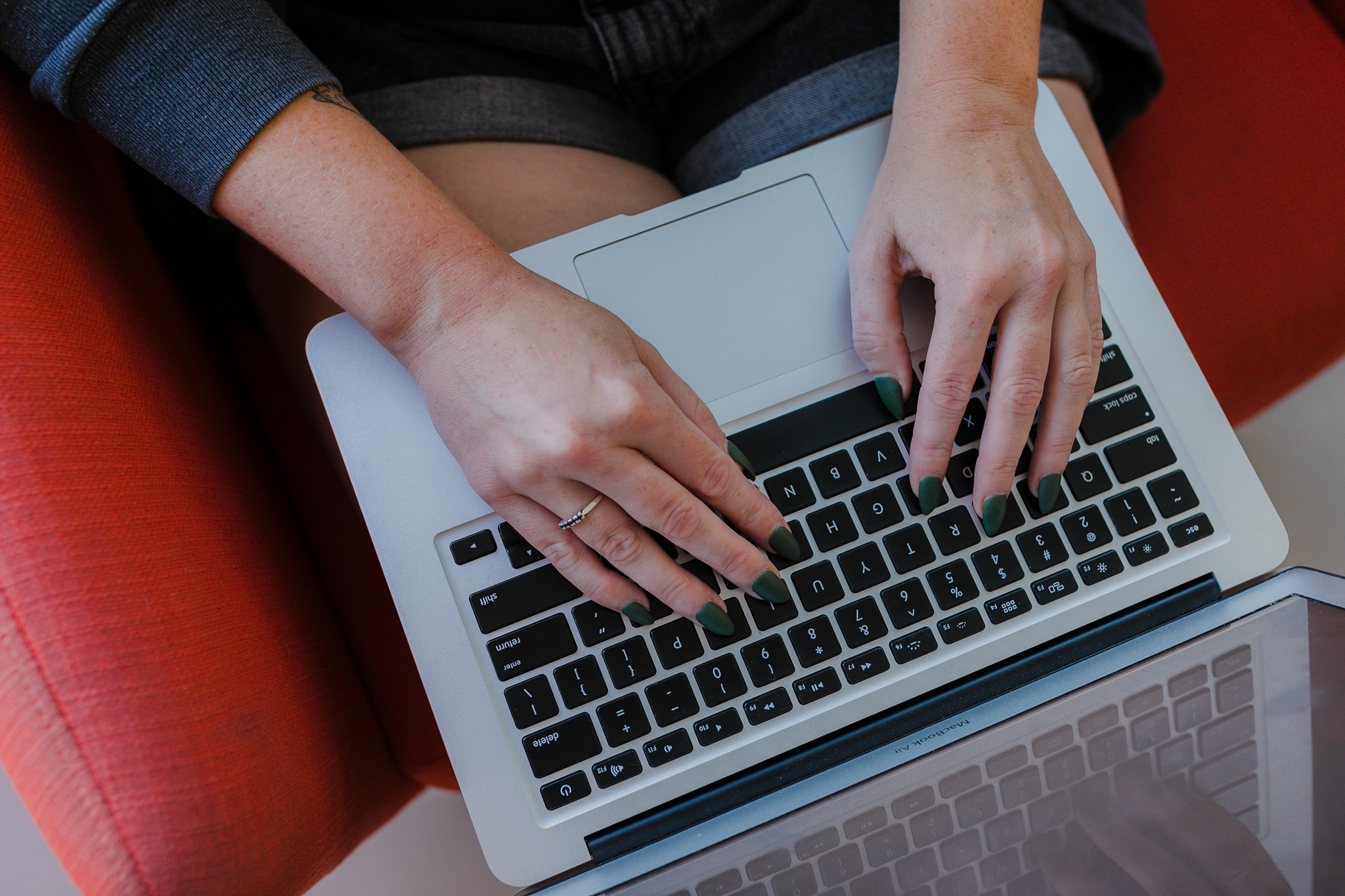 Hands typing on laptop - working from home