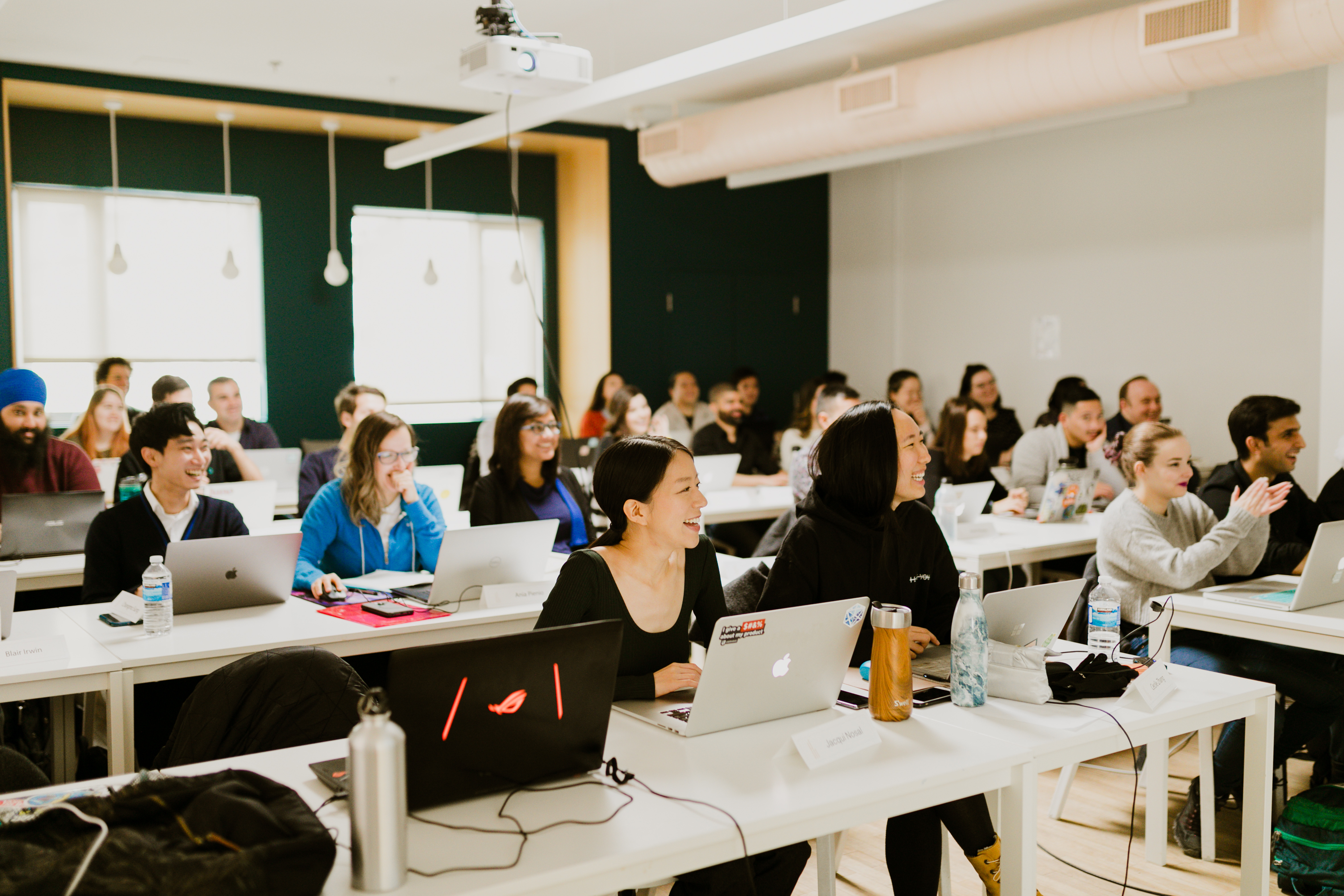 View of a standard Juno classroom overlooking the students working on their laptops.