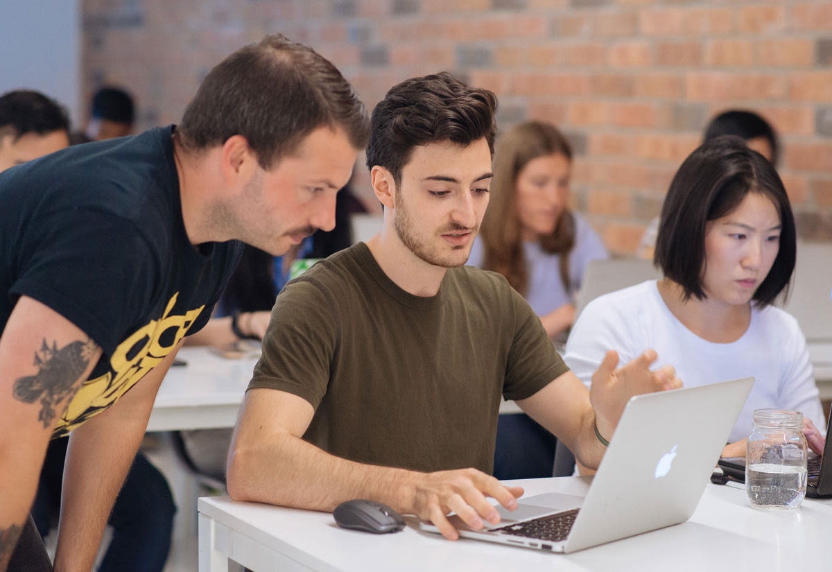 A Juno instructor helping a student in class