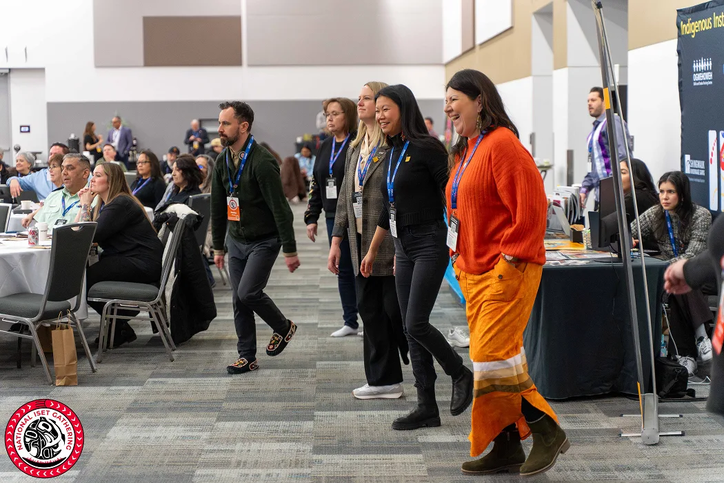 Conference attendees learn a dance