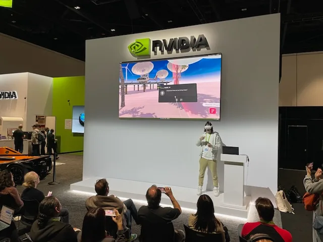 A person presenting NVIDIA CloudXR technology by OVA at a trade show

