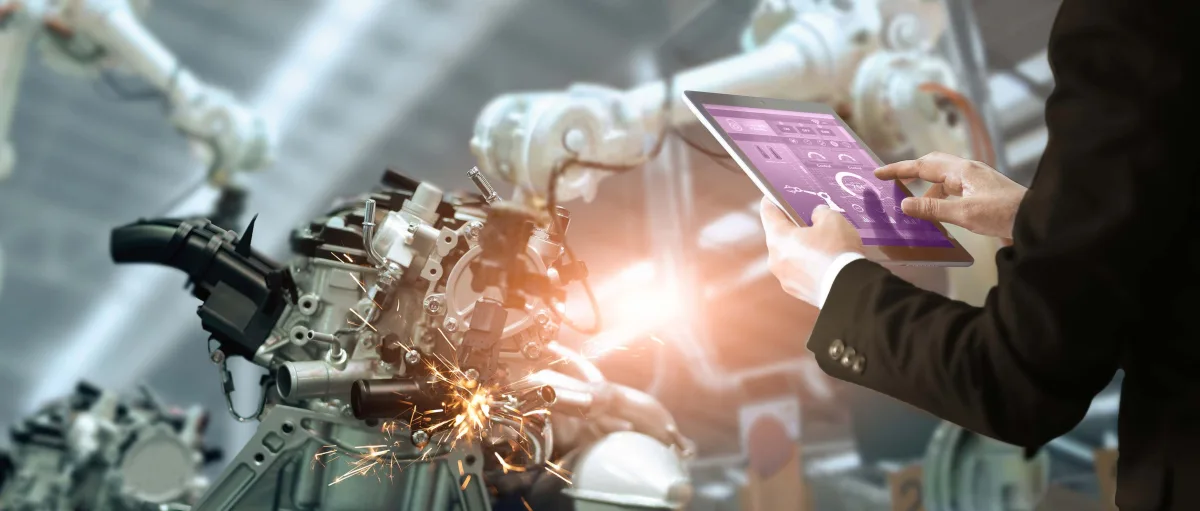 A person inspecting a piece of communications technology hardware
