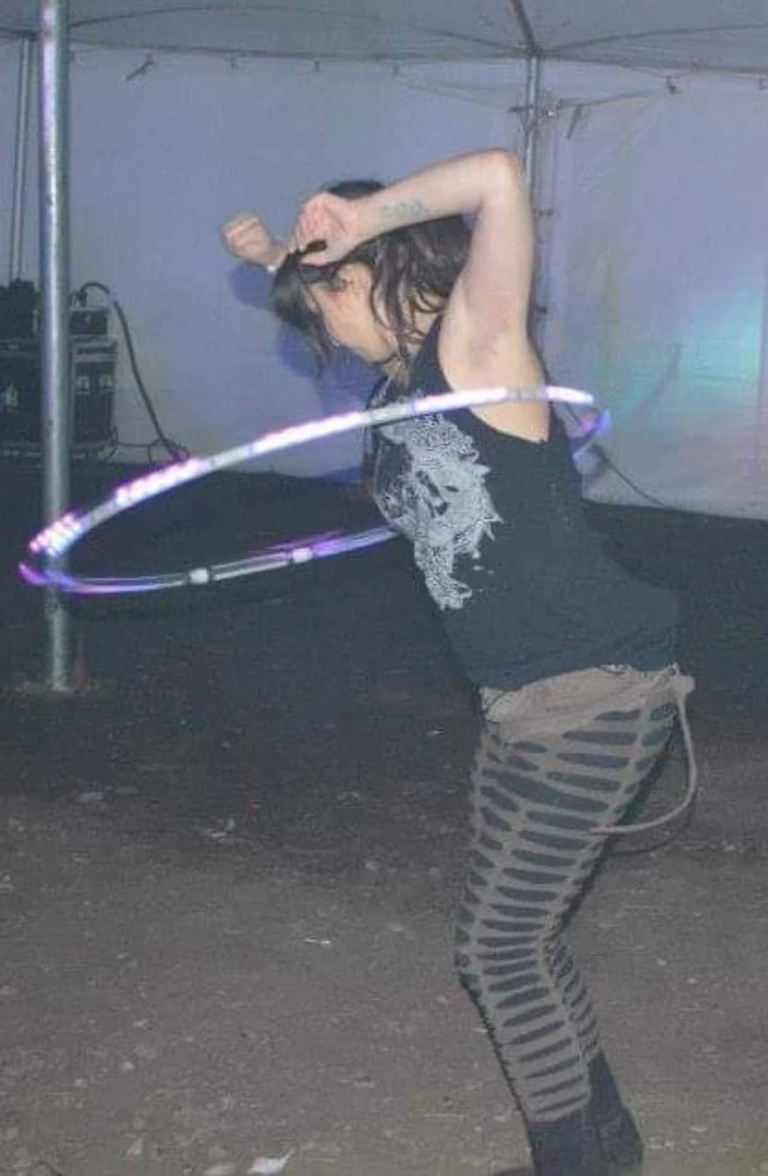 A team member dances with a hula hoop
