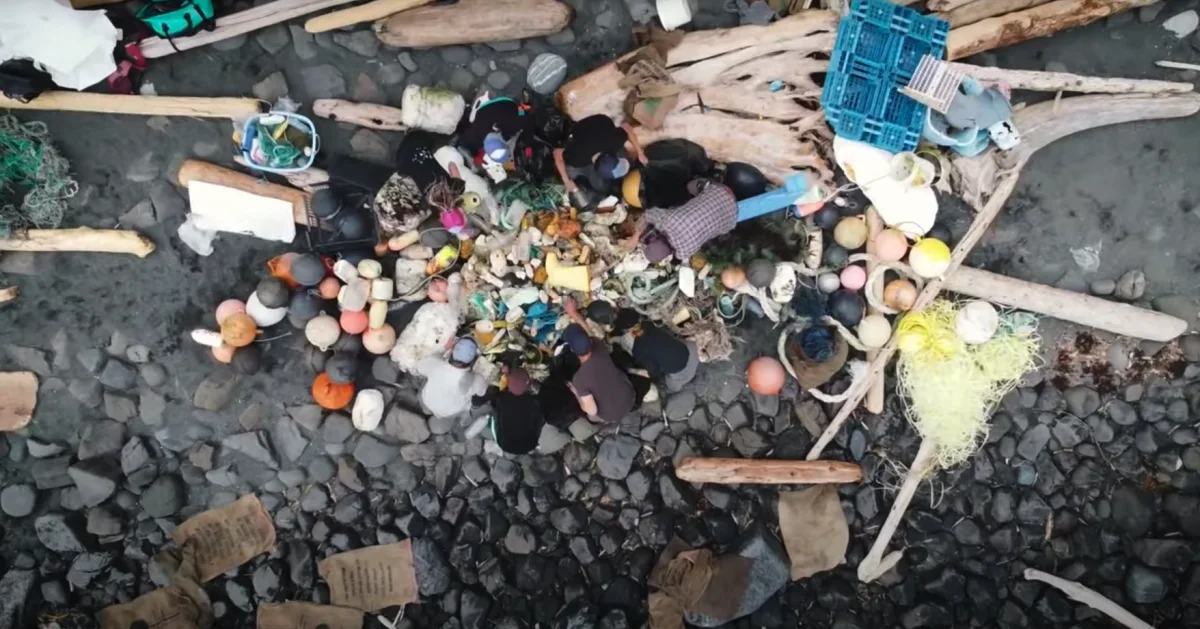 Aerial view of a ship full of trash on the ocean