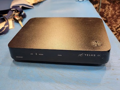 An Optik TV set-up box ready collected for recycling.

