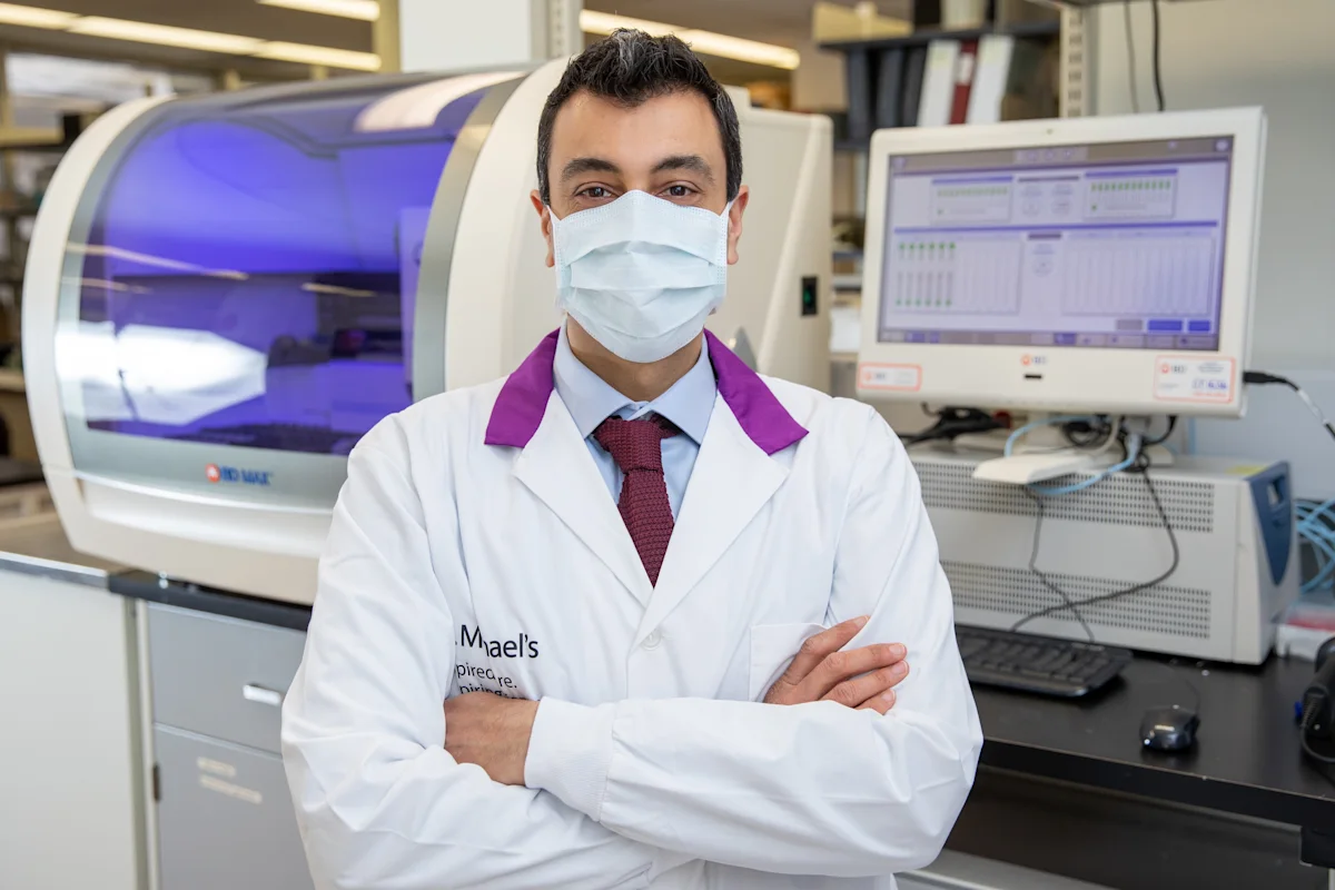 Doctor standing in front of medical machinery