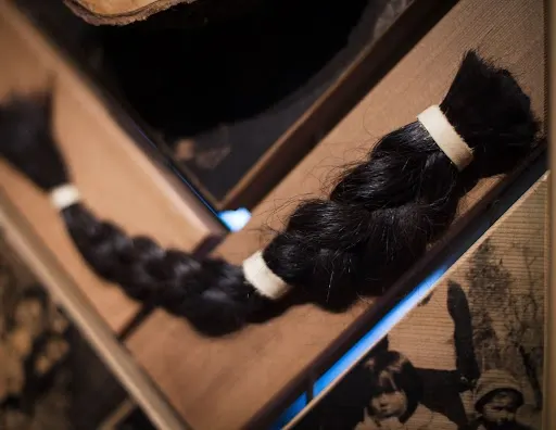 The Indigenous cultural practice of cutting hair represents mourning and respect.