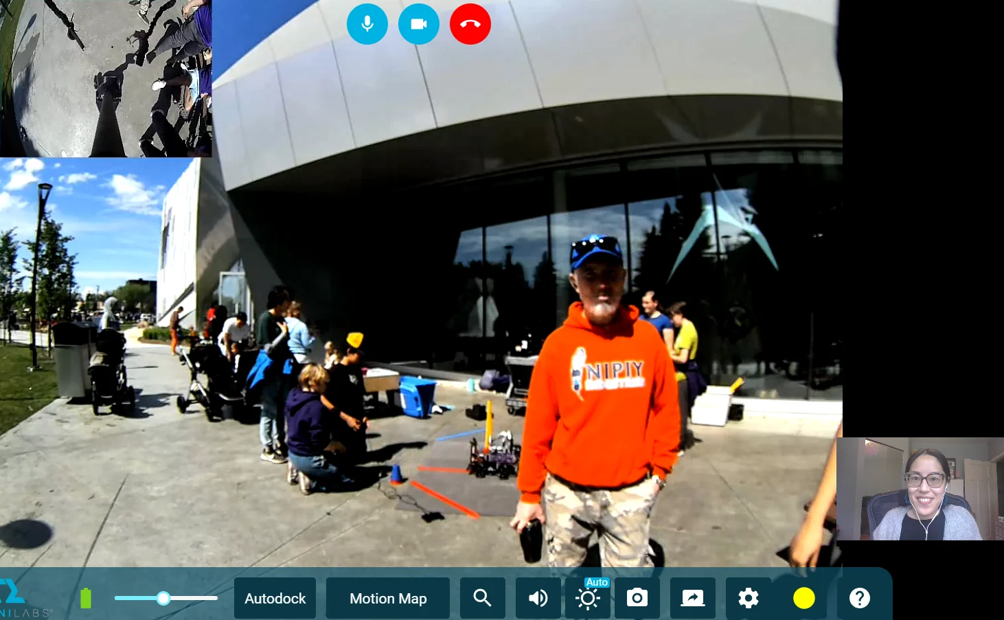 A screenshot of a live stream from National Indigenous Peoples Day, where families gather outside of TELUS World of Science.
