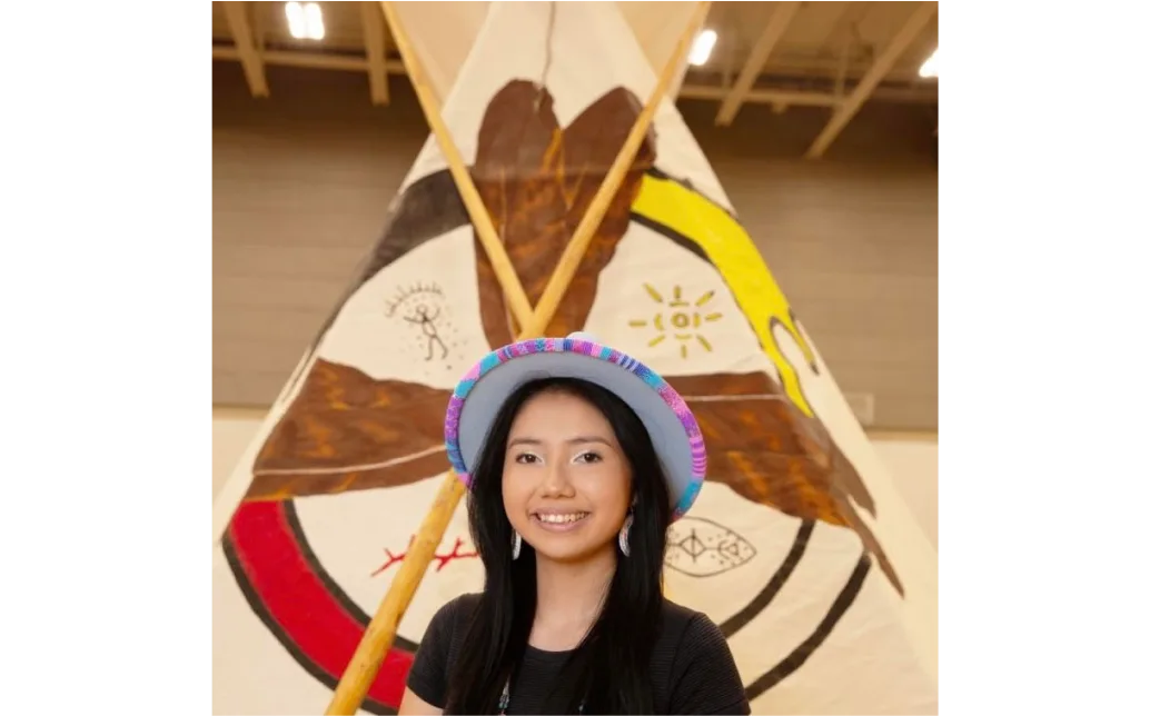 Tiya standing in front of historical artifacts