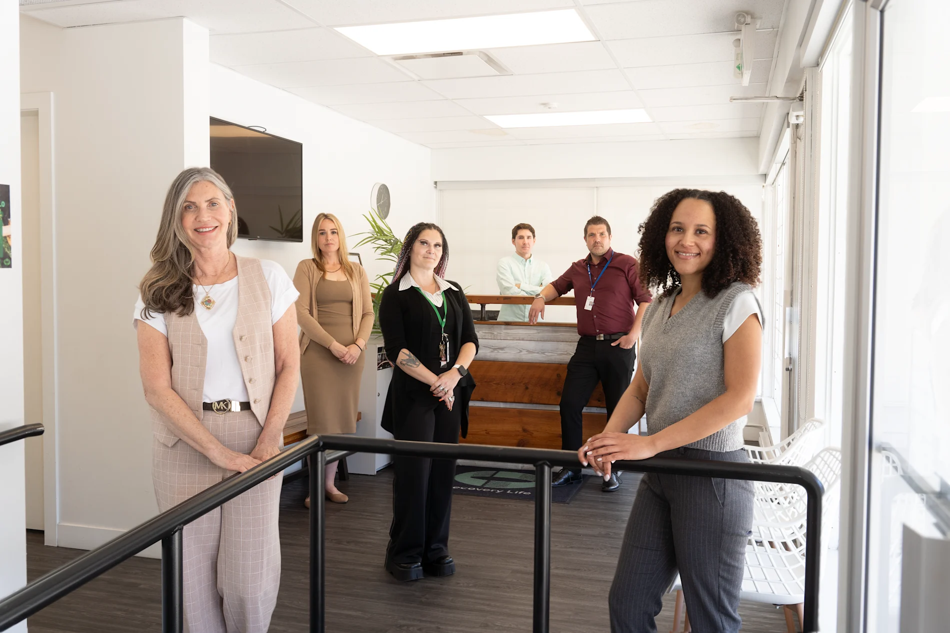Together We Can team posing in a clinical setting.