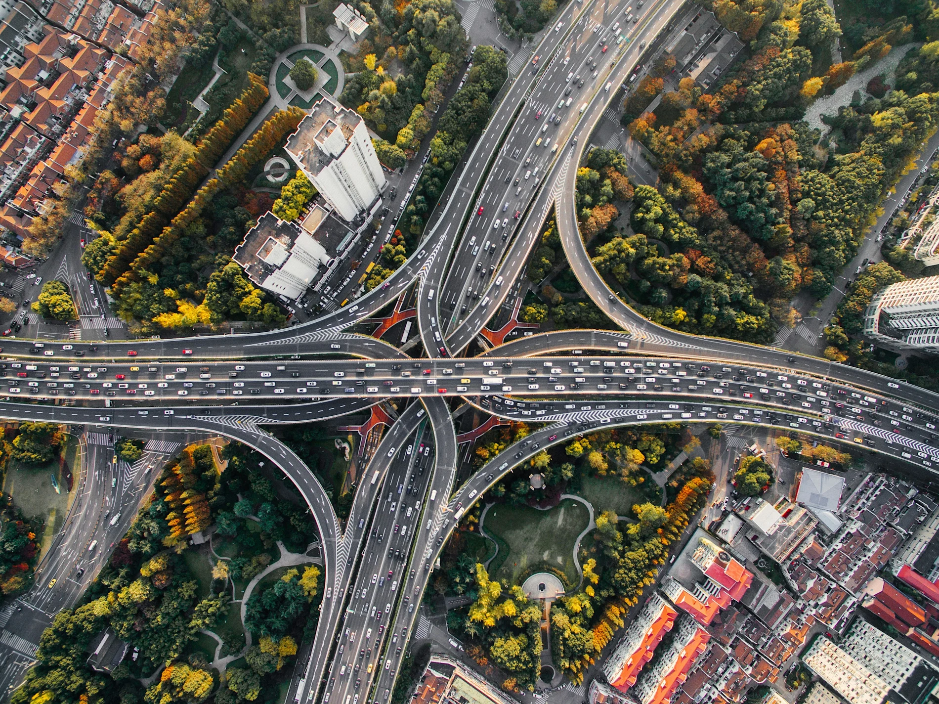 An aerial view of major roads running through a city.