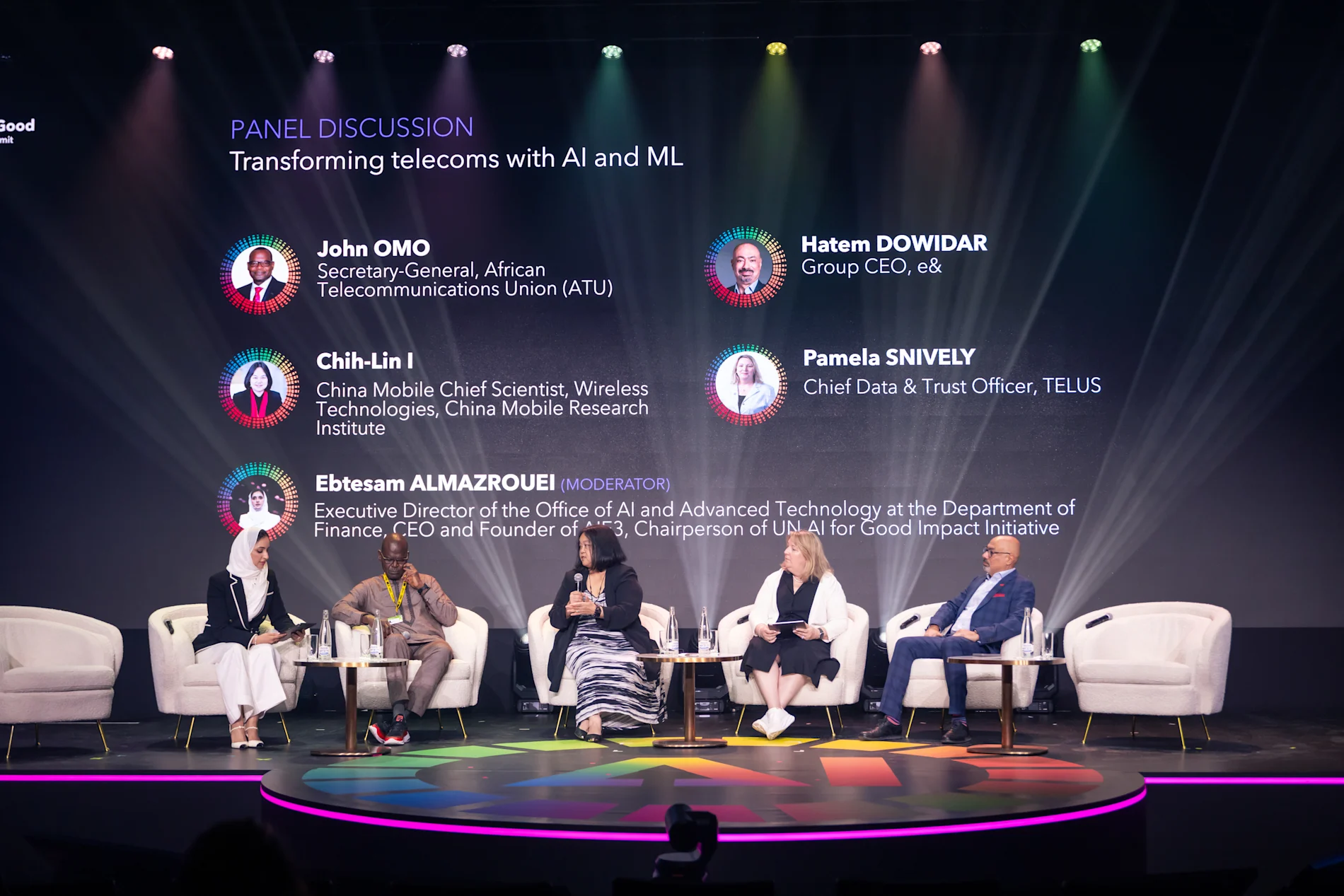 Speaker panelists seated in discussion at the UN AI for Good Summit.

