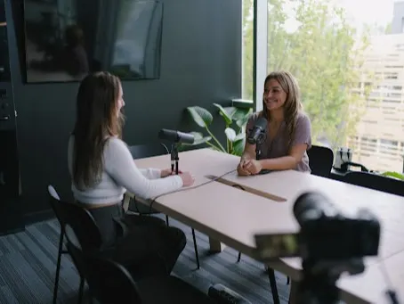 STORYHIVE Voices creators, Jaemie Sures and Vanessa Alessio, filming for their visual podcast Low Key Obsessed. 