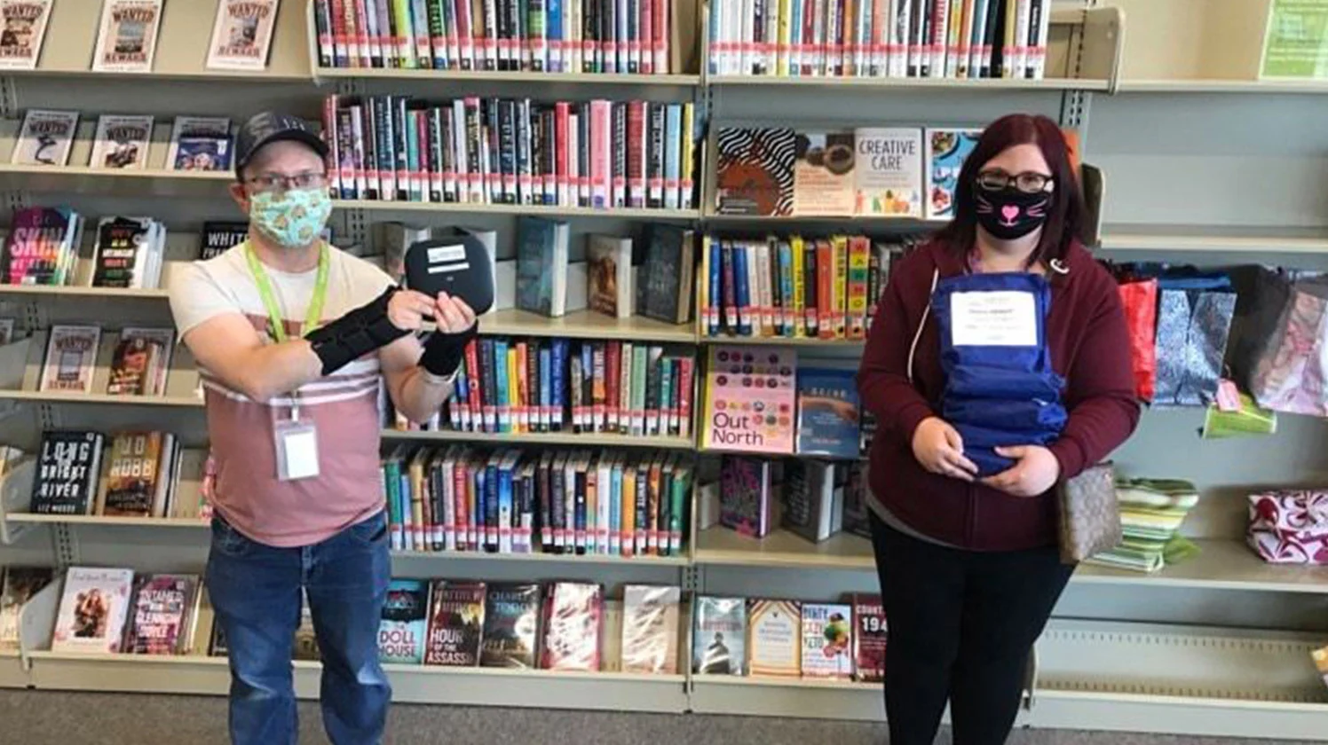 Corey Chernuka and Hailey McCullough show off the new Smart Hub devices available to the public through the Grande Prairie Public Library. The internet lending program is “another way we show our community we care,” says McCullough. PHOTO SUBMITTED