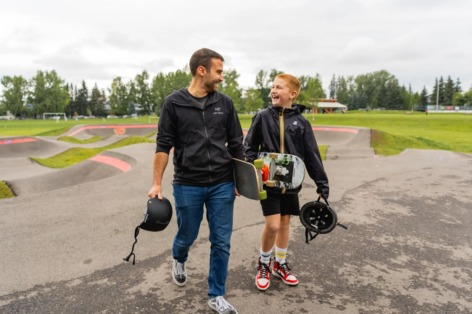 Make mentor and mentee walking and talking while holding their skateboards.