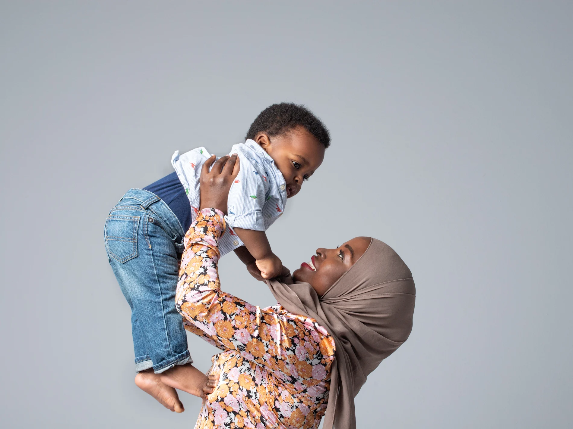 Mother holding up her child