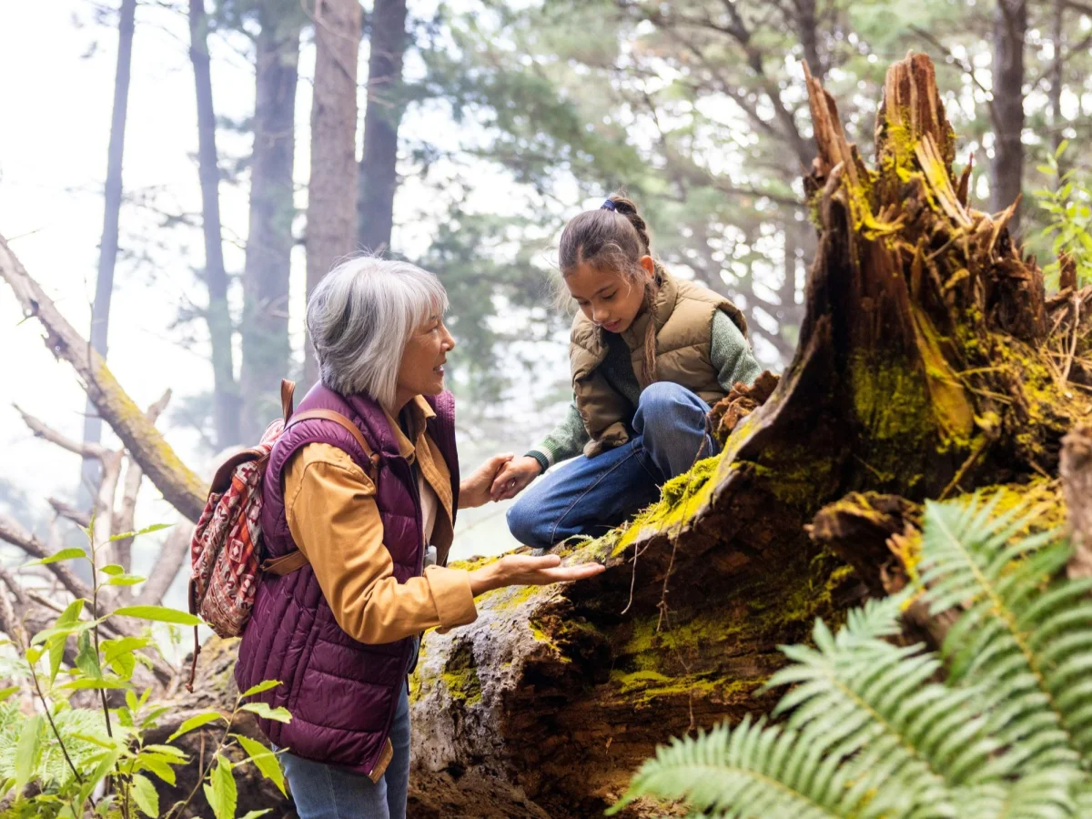 Woman and girl in forest 