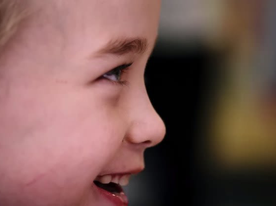 A closeup shot of Oliver smiling