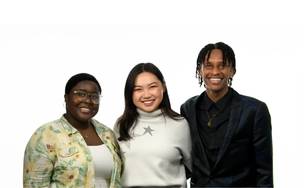 Three Bursary recipients smiling together at the TELUS Stuent Bursary launch event.