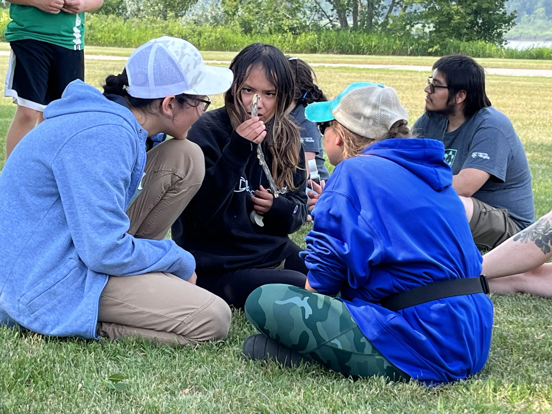 Campers at University of Regina’s Science Camps for Saskatchewan Indigenous Youth sitting in a circle together. 