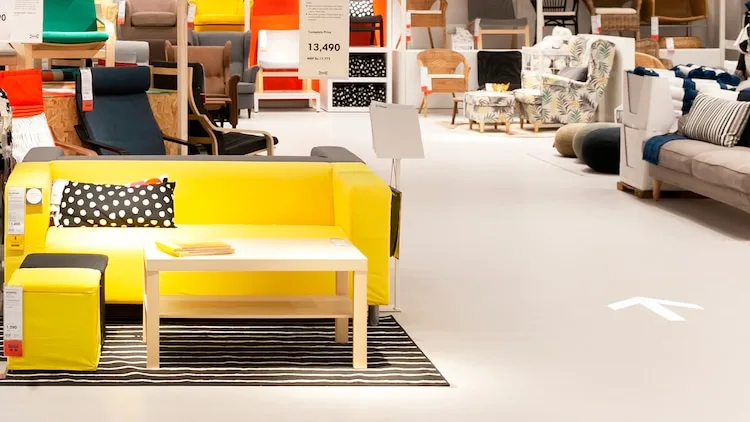 An image of an IKEA store, displaying the arrows inside the store to direct customers. 