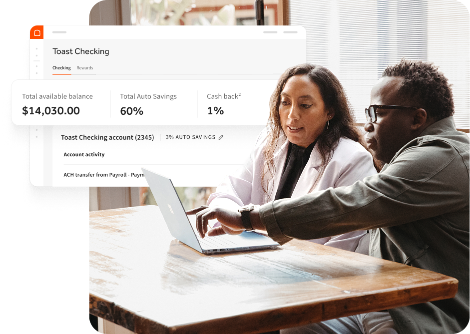 Two restaurant owners looking at a laptop screen showing a Toast Capital offer for fast business funding.