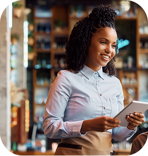 Store manager checking inventory on a tablet
