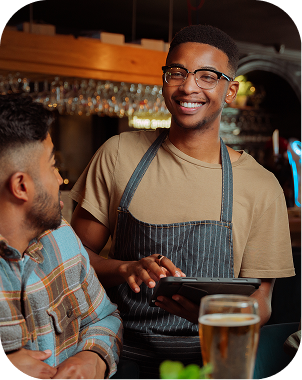 Bartender greeting a guest at the counter