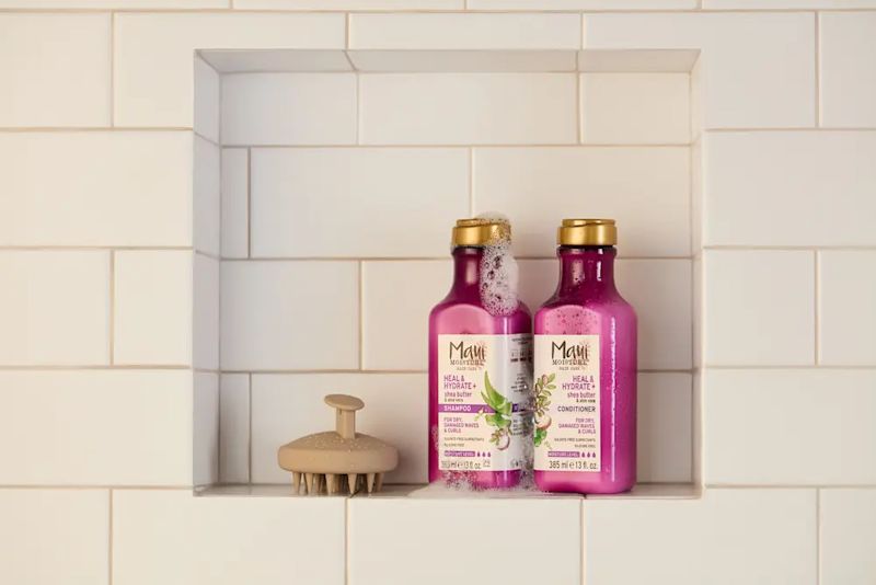  Maui Moisture® Heal & Hydrate + Shea Butter Shampoo and Conditioner Hair Care set in a shower