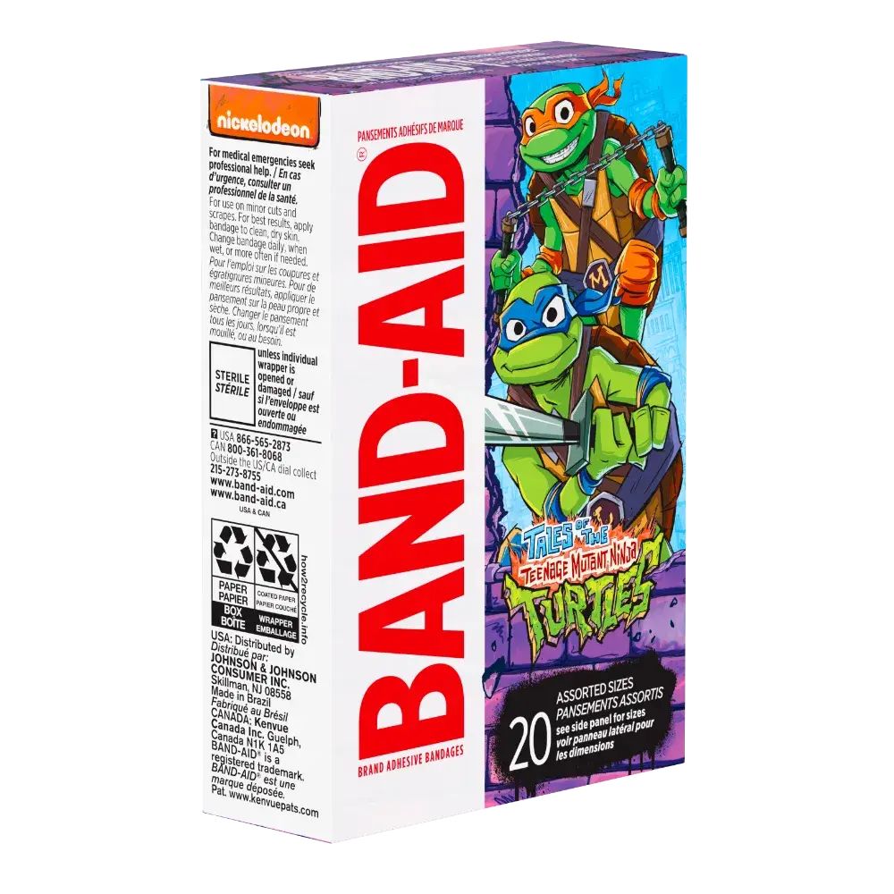 A box of Band-Aid brand adhesive bandages featuring Teenage Mutant Ninja Turtles artwork. The box is purple and features the TMNT characters prominently. The text indicates the bandages are assorted sizes and sterile. The Nickelodeon logo is also visible.