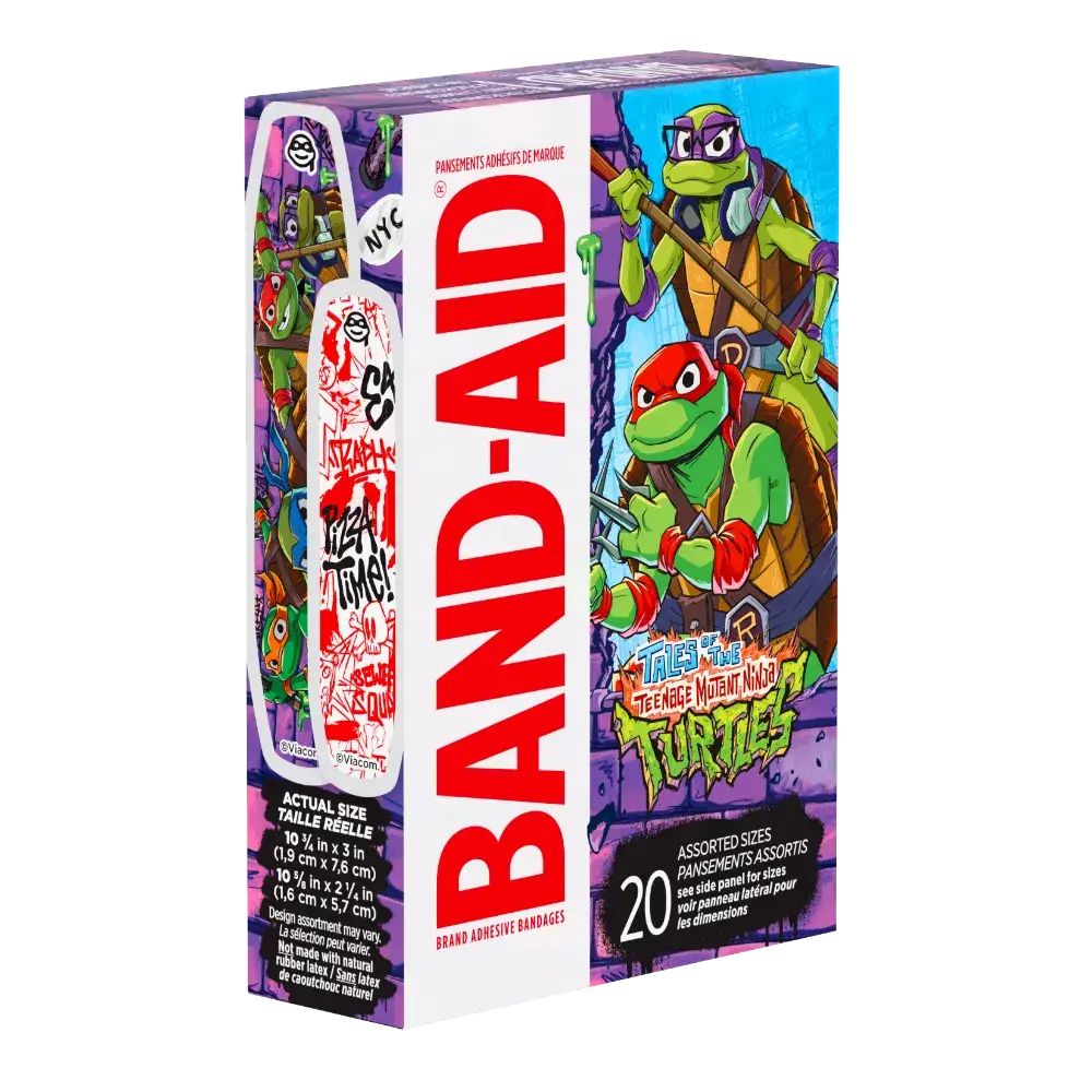 Behold, a box of Band-Aid brand adhesive bandages with the coolest Teenage Mutant Ninja Turtles graphics, showing you the actual size of the bandages. It's a mix of sizes, and the packaging is bursting with the vibrant artwork of Donatello and Raphael.