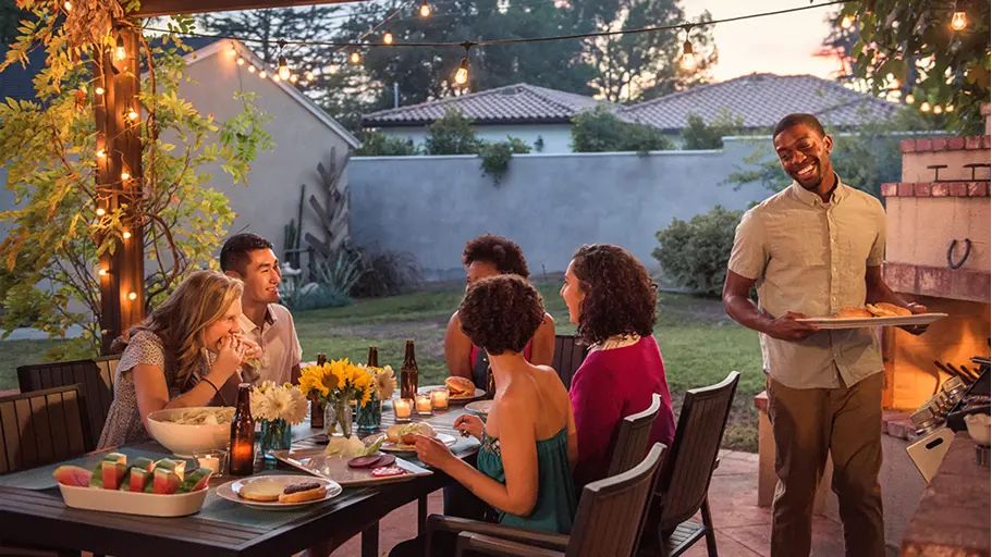 People enjoying a barbecue together outside