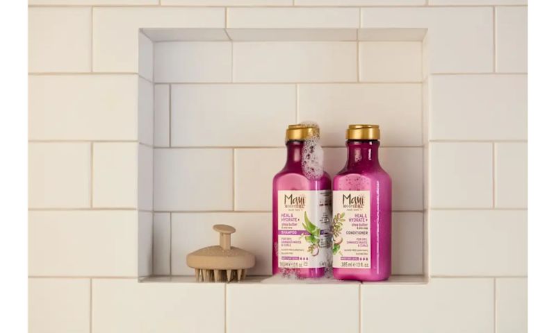 Maui Moisture® Heal & Hydrate + Shea Butter Shampoo and Conditioner Hair Care set in a shower