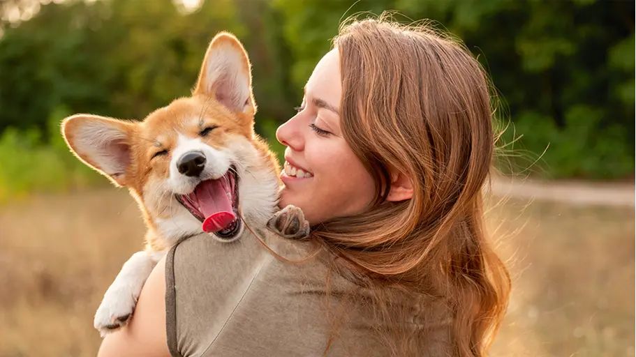 A person enjoying time outside with their dog
