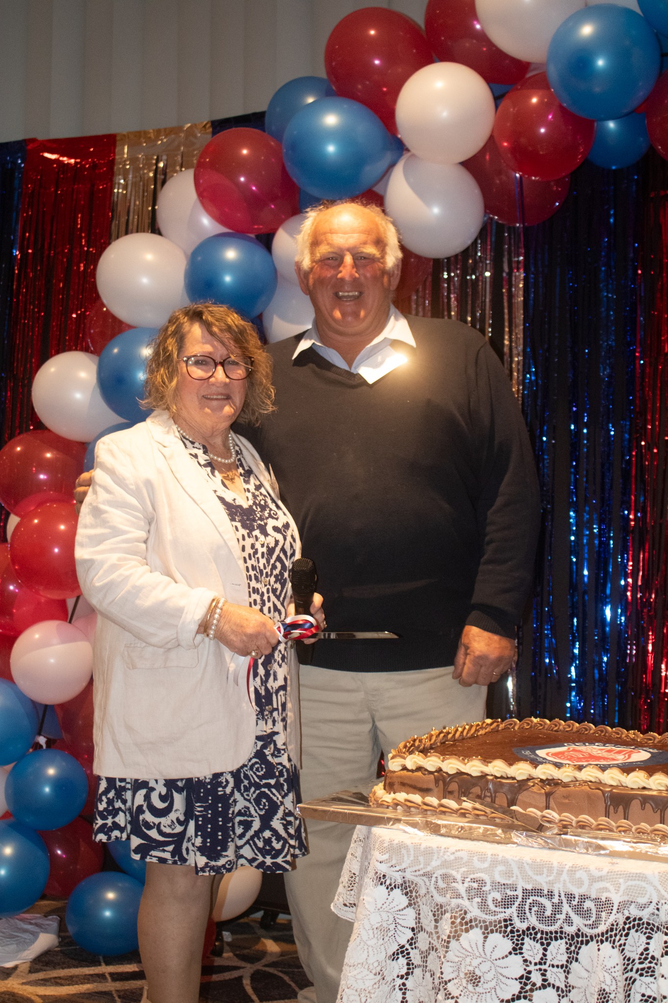 155 organising committee chair Chris Coble and ex-student Mark Flannery cutting the celebration cake