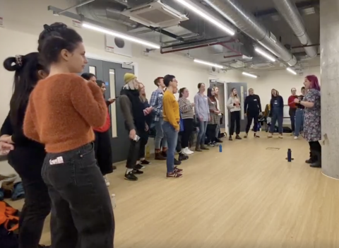 Members of SHE Choir London rehearsing 