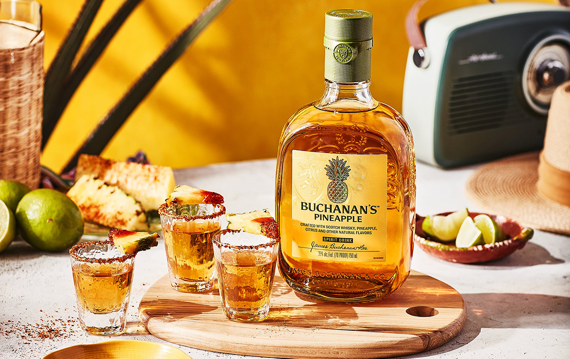 3 chilled shots of Buchanan's Pineapple rimmed with Chamoy and Tajín and served with a lime wedge