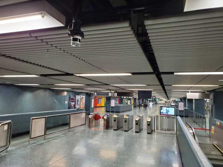 An Ouster digital lidar sensor mounted in a subway station to monitor pedestrian traffic