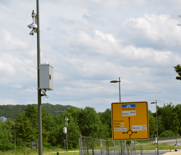 Ouster digital lidar sensors installed on a traffic pole near a roundabout in Aachen, Germany