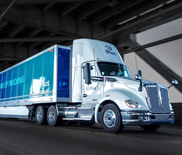 A plus autonomous truck with Ouster lidar sensors driving on the highway