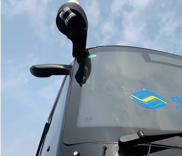 An Ouster digital lidar sensor mounted on a QCraft bus