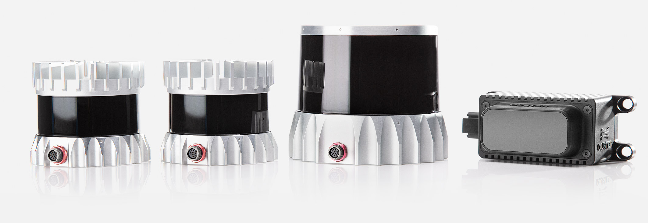 The Ouster Lidar Sensors: OS2 long-range lidar sensor, OS1 lidar sensor with radial cap, and OS0 ultra-wide field of view lidar sensor with configurable flat cap.