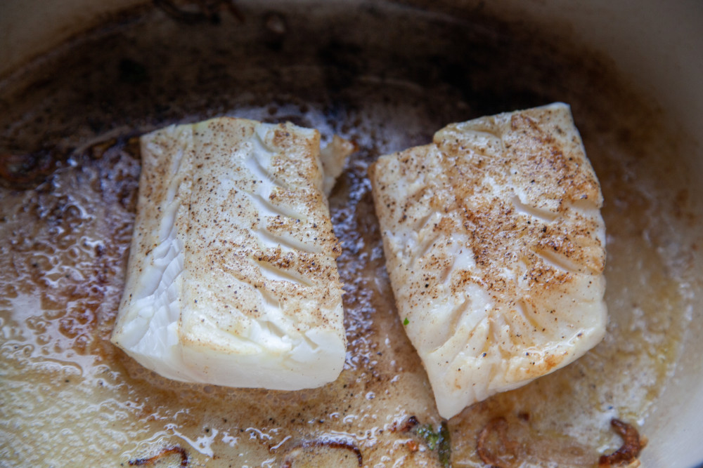 Season fish filets with salt and pepper and brown them lightly with the shallots. When browned (they do not need to be cooked through), remove filets to a plate and set aside.