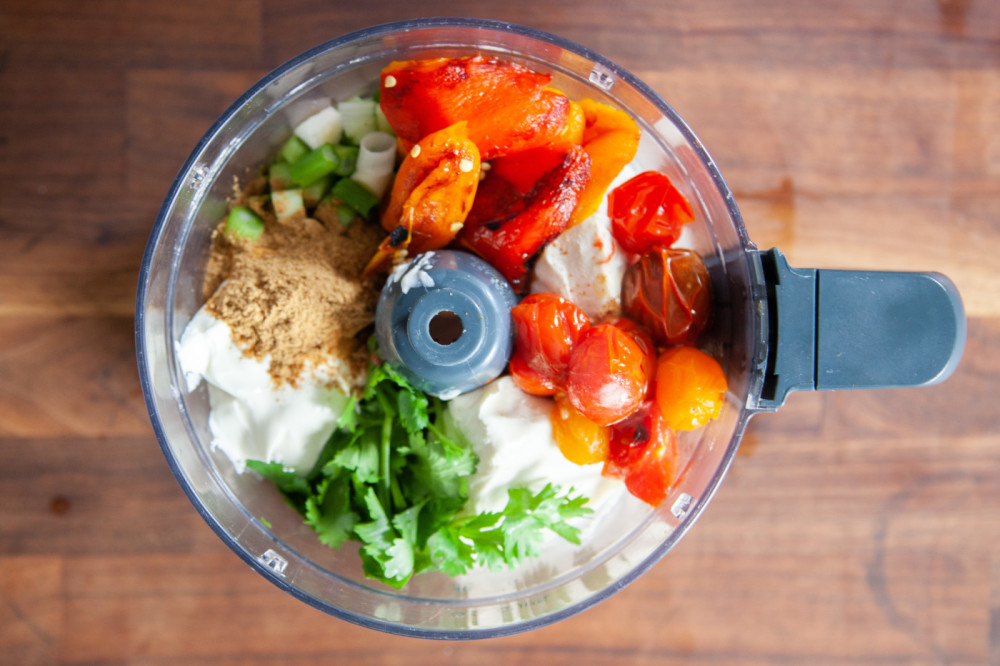 Place all ingredients in the bowl of a food processor and blend until smooth.