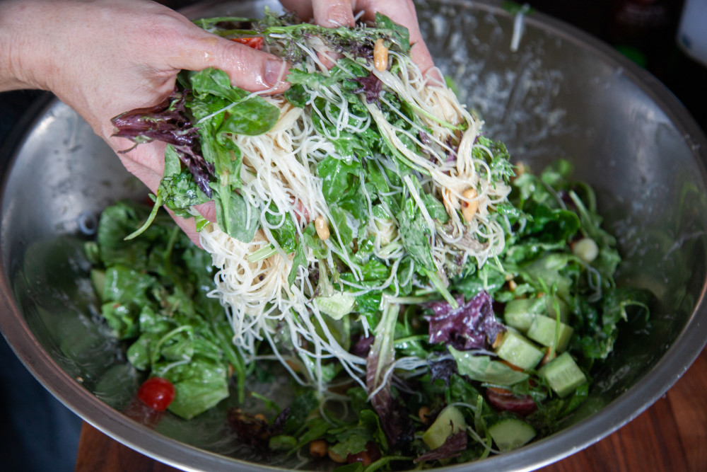 Pour over the salad and toss everything together with your hands until dressing gets in every nook & cranny. 